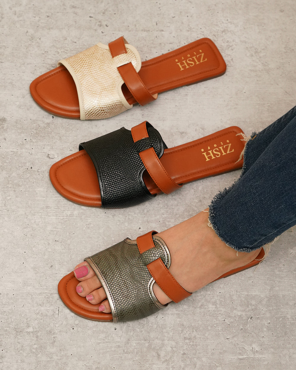 Gunmetal Meghan Flats strappy woven sandals with brown straps and flat sole, worn with jeans