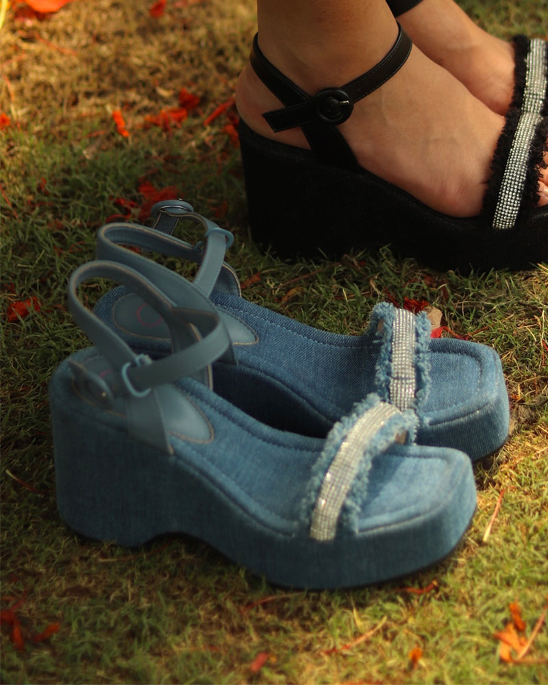 Blue denim wedge sandals with diamond embellishments on beach sand, open toe, 3-inch heel