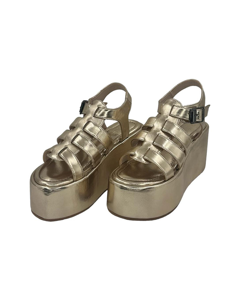 Golden chunky heel caged platform sandals with open toe and ankle buckle closure