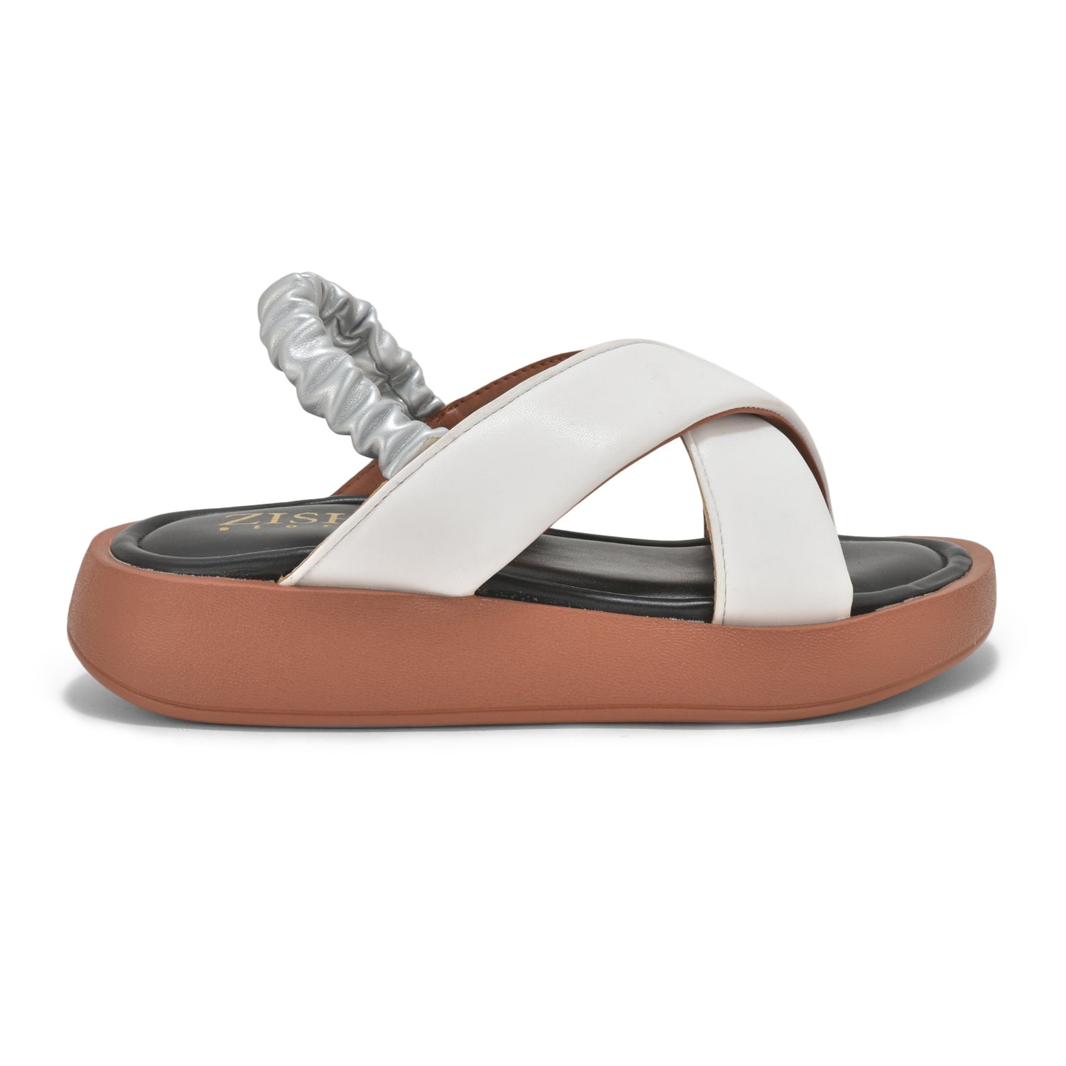 Side view of tan and white dual criss-cross sandals with cushioned insole and elastic back strap on a lightweight platform sole