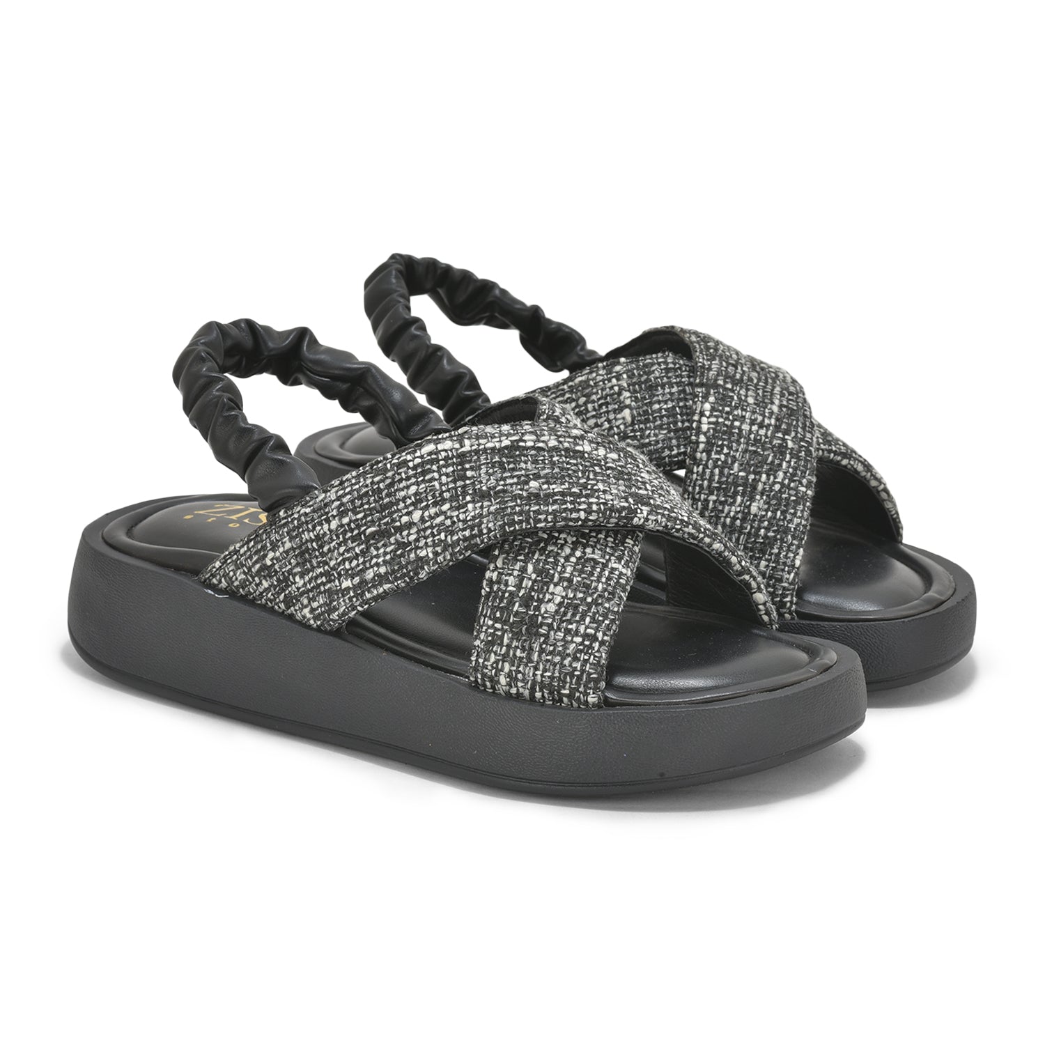 Black tweed criss-cross sandals with cushioned insole, elastic back strap, and lightweight platform heel.