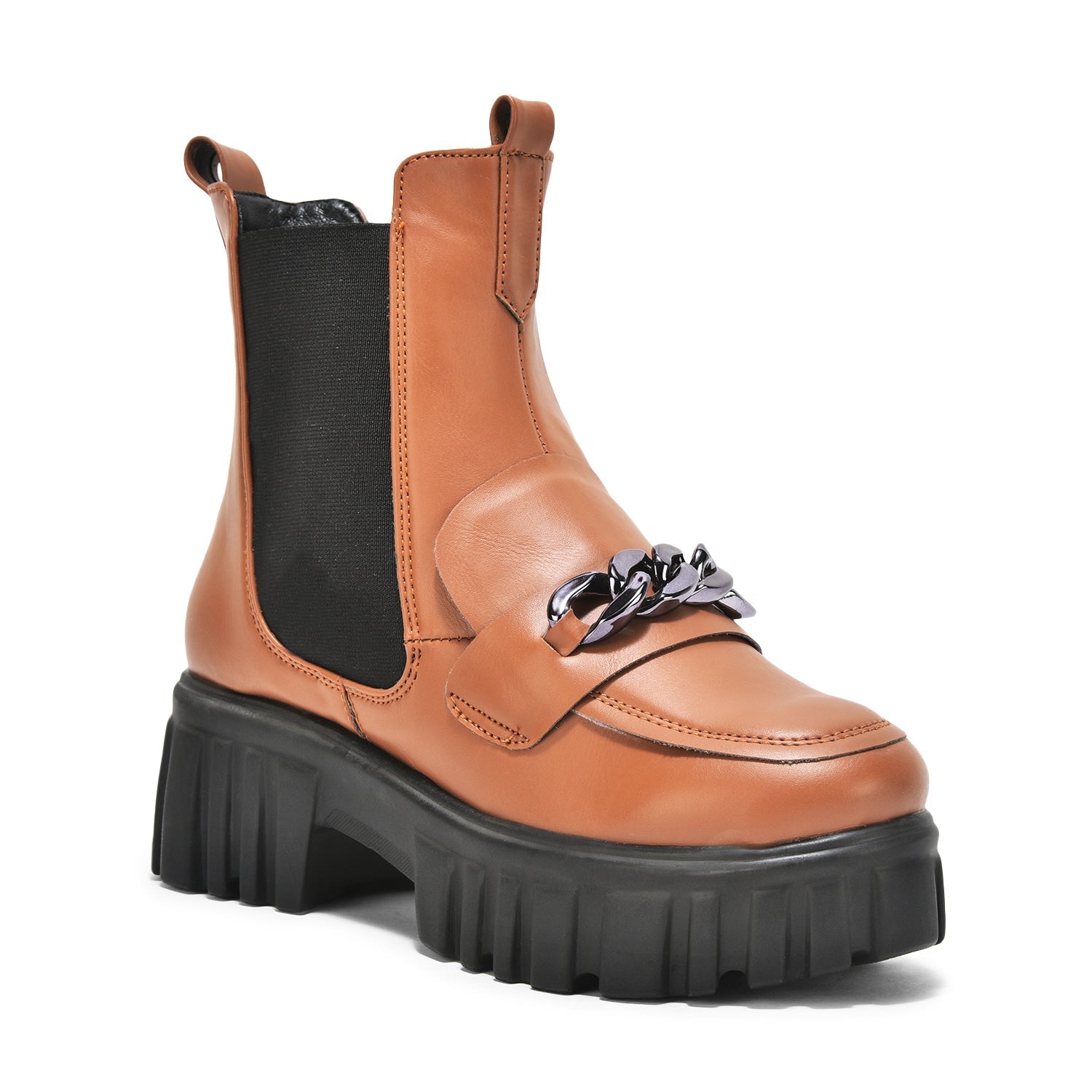Tan handcrafted side zipper ankle boots with chunky black sole and silver front buckle detail.