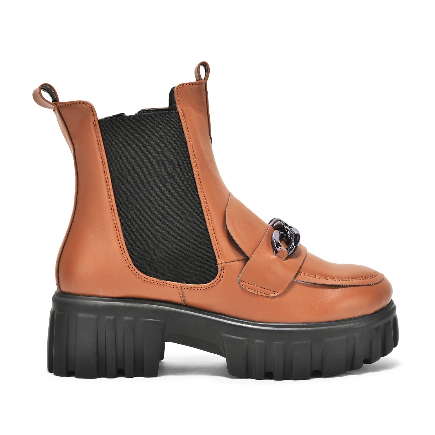 Tan handcrafted side zipper ankle boots with elastic panels and chunky black sole.