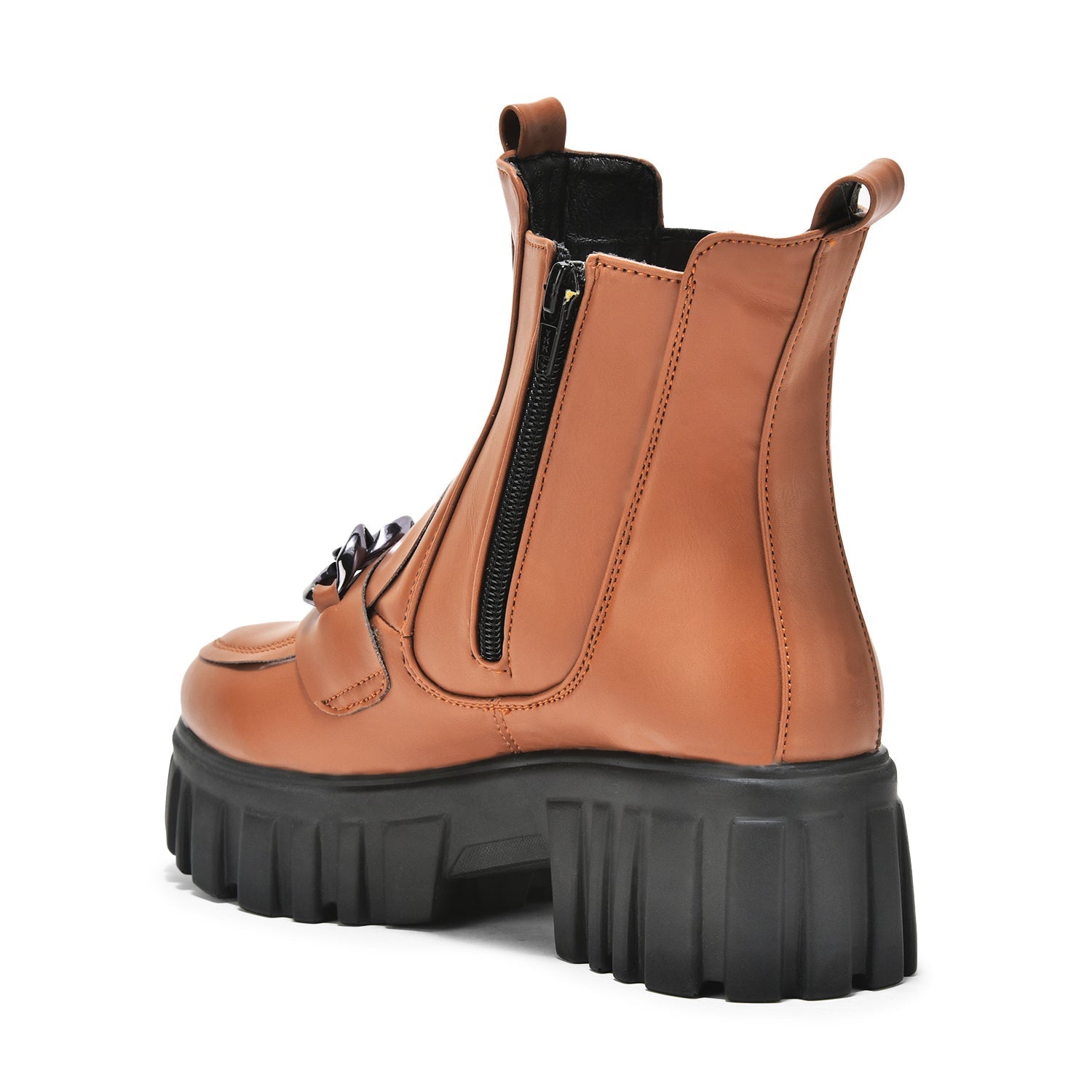 Tan handcrafted side zipper ankle boot with chunky black sole and elastic panel