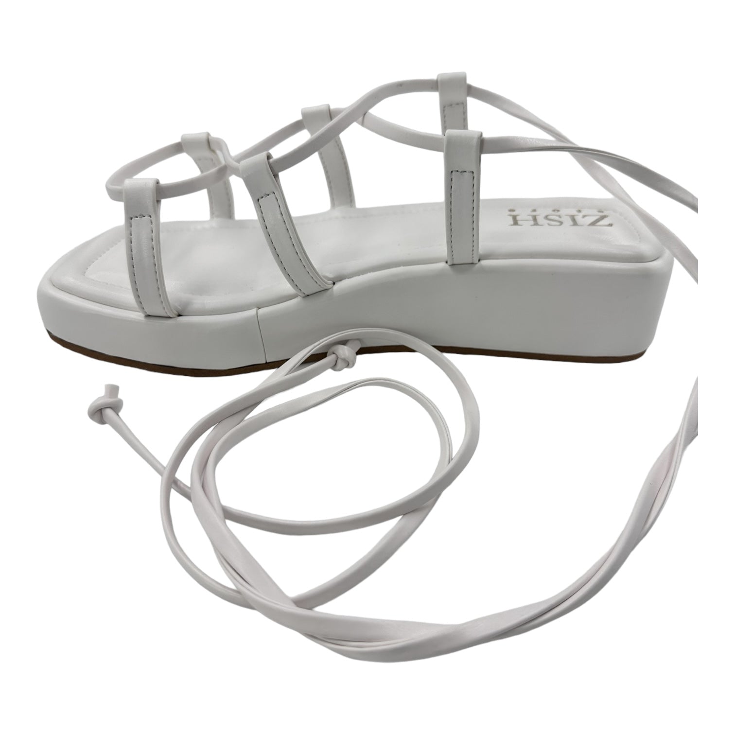 White platform tie ups flats with 1-inch sole and vegan leather straps