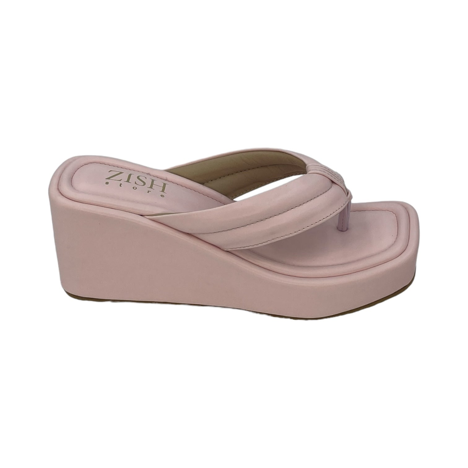 Pink wedge slides with simple strap and 3-inch platform heel in vegan leather.