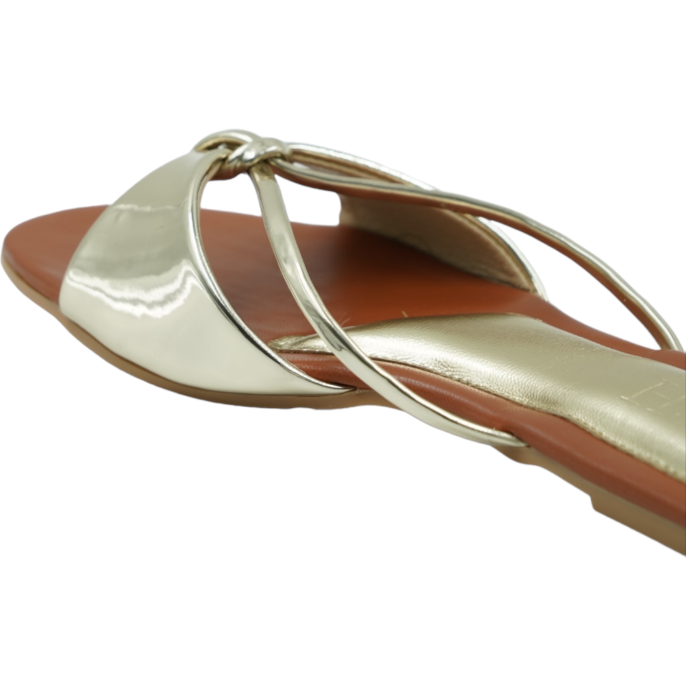 Gold Carolina Flats with glossy mirror strap and brown footbed, open-toe flat sandals for casual and formal wear