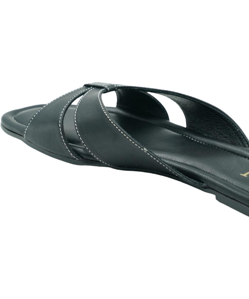 Black Tokyo Flats with elegant cross-strap design, vegan leather, and cushioned insole for all-day comfort