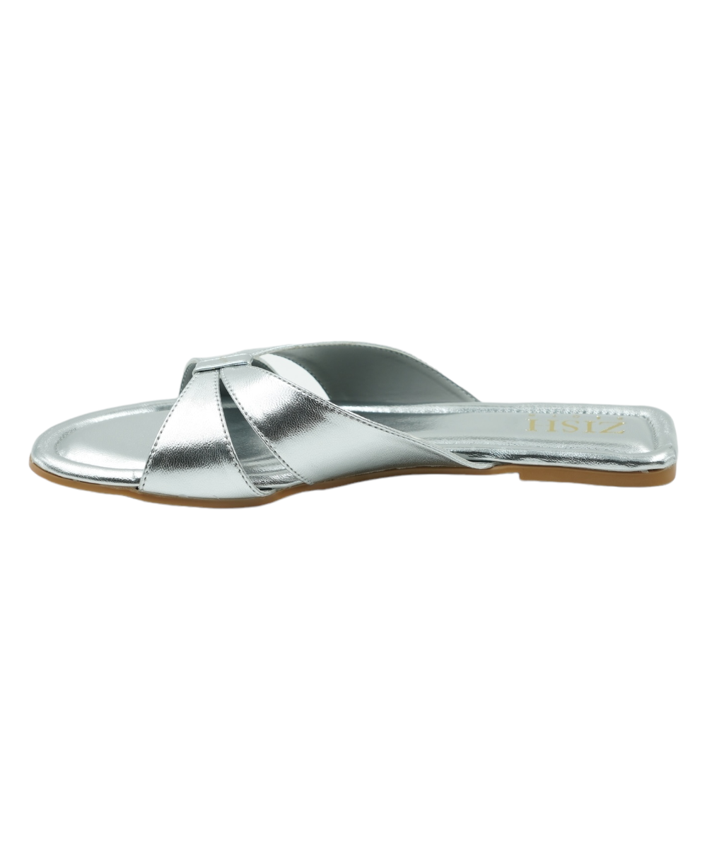 Silver Tokyo Flats with elegant cross-strap design, open-toe, flat heel, and vegan leather material.