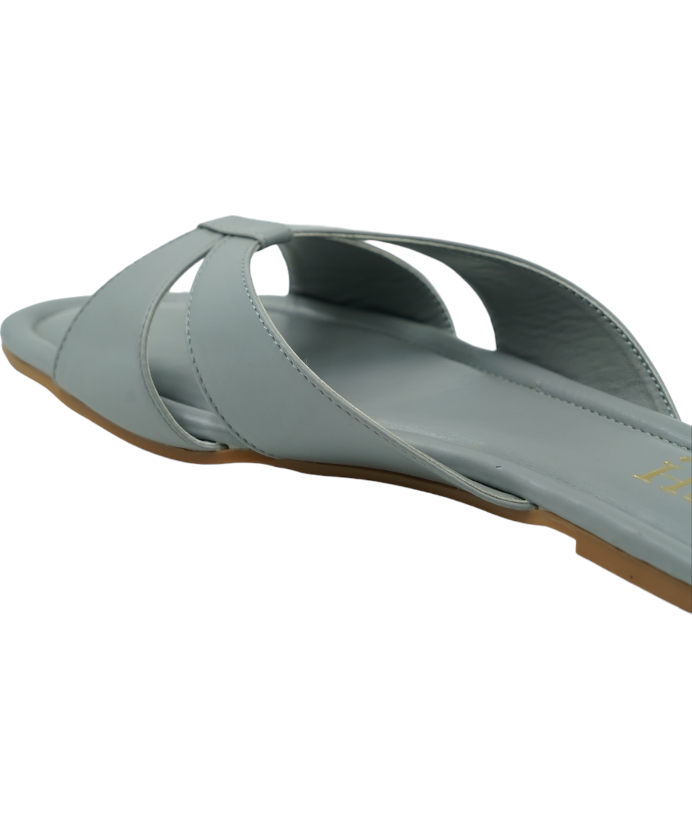 Grey cross-strap flats made of vegan leather with flat PVC sole and open toe design