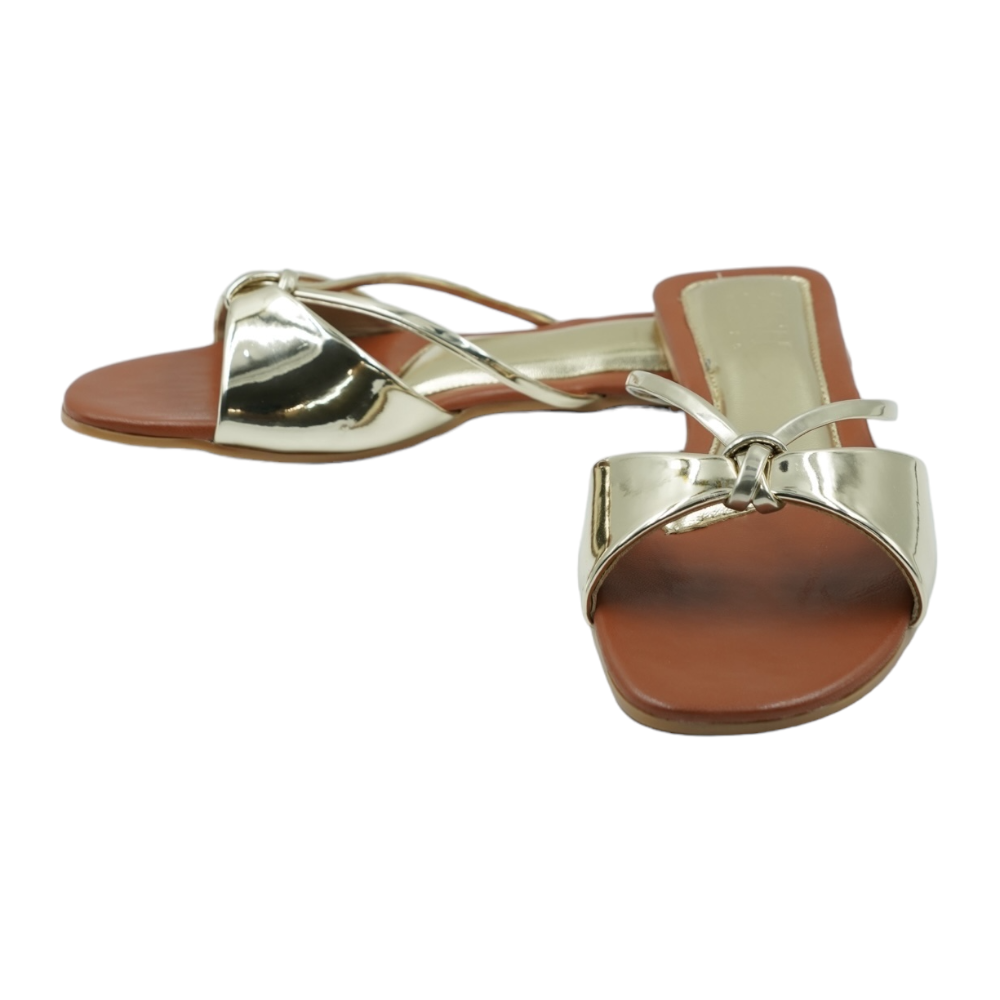 Gold Carolina Flats with glossy mirror strap and brown footbed, open toe, flat heel, vegan leather sandals for formal and casual wear.