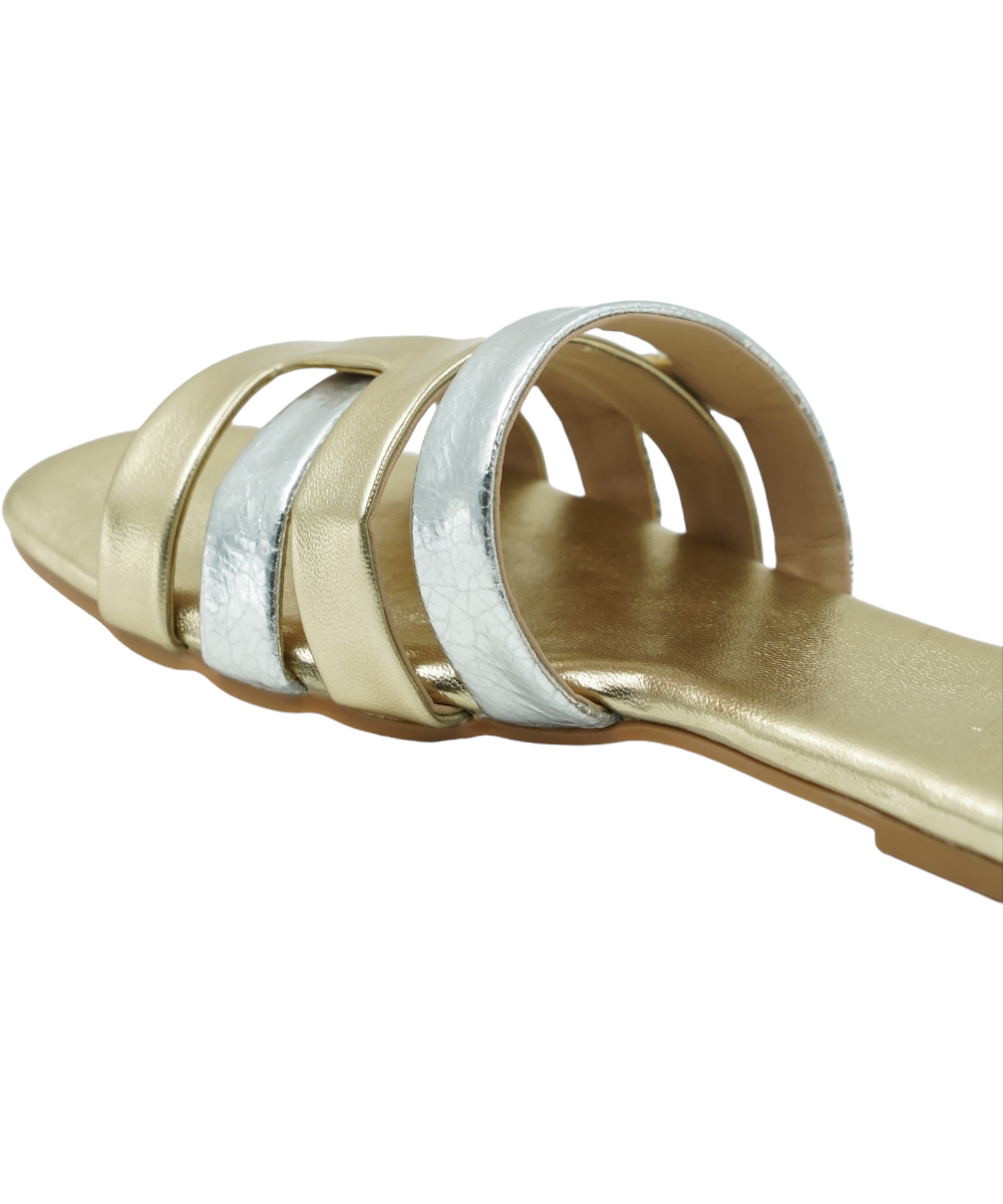 Close-up of Gold Azzura Flats featuring gold and silver geometric design with flat sole and open toe style
