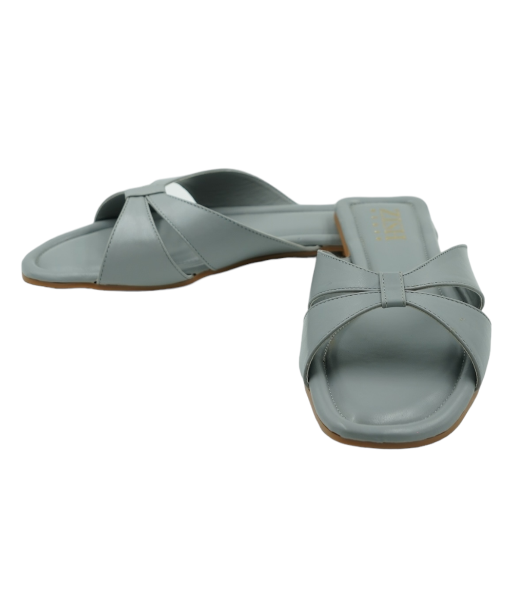 Grey cross-strap flats with open toe and cushioned vegan leather insole for casual and formal wear