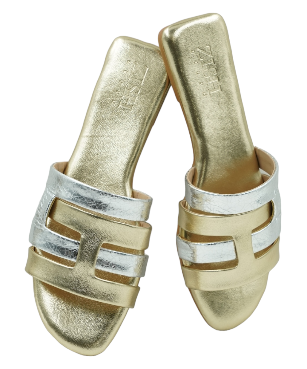 Pair of Gold Azzura Flats with gold and silver geometric design, flat open-toe sandals made from vegan leather.