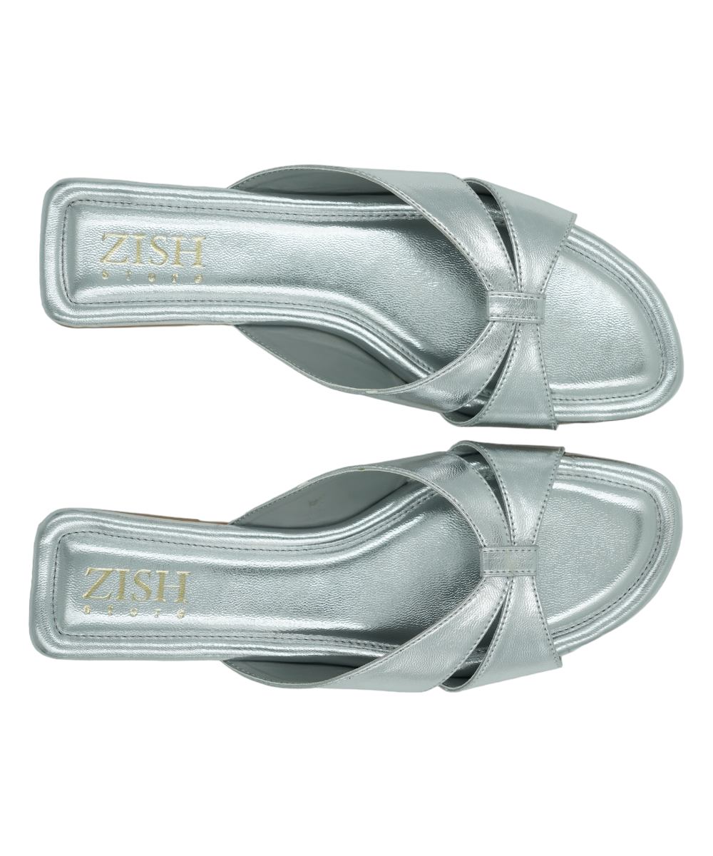 Pair of silver cross-strap flat sandals with cushioned insoles for comfort and formal or party wear.