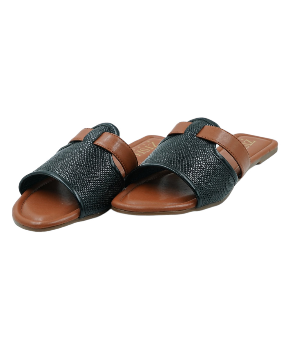 Black Meghan Flats with woven textured straps and brown footbed, open-toe vegan leather sandals.