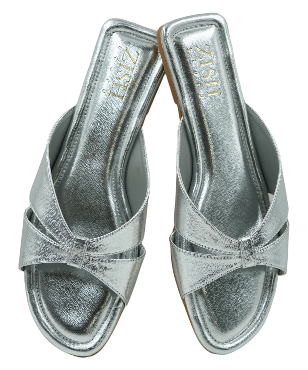 Silver Tokyo Flats open-toe cross-strap vegan leather sandals with cushioned insoles and flat PVC soles.