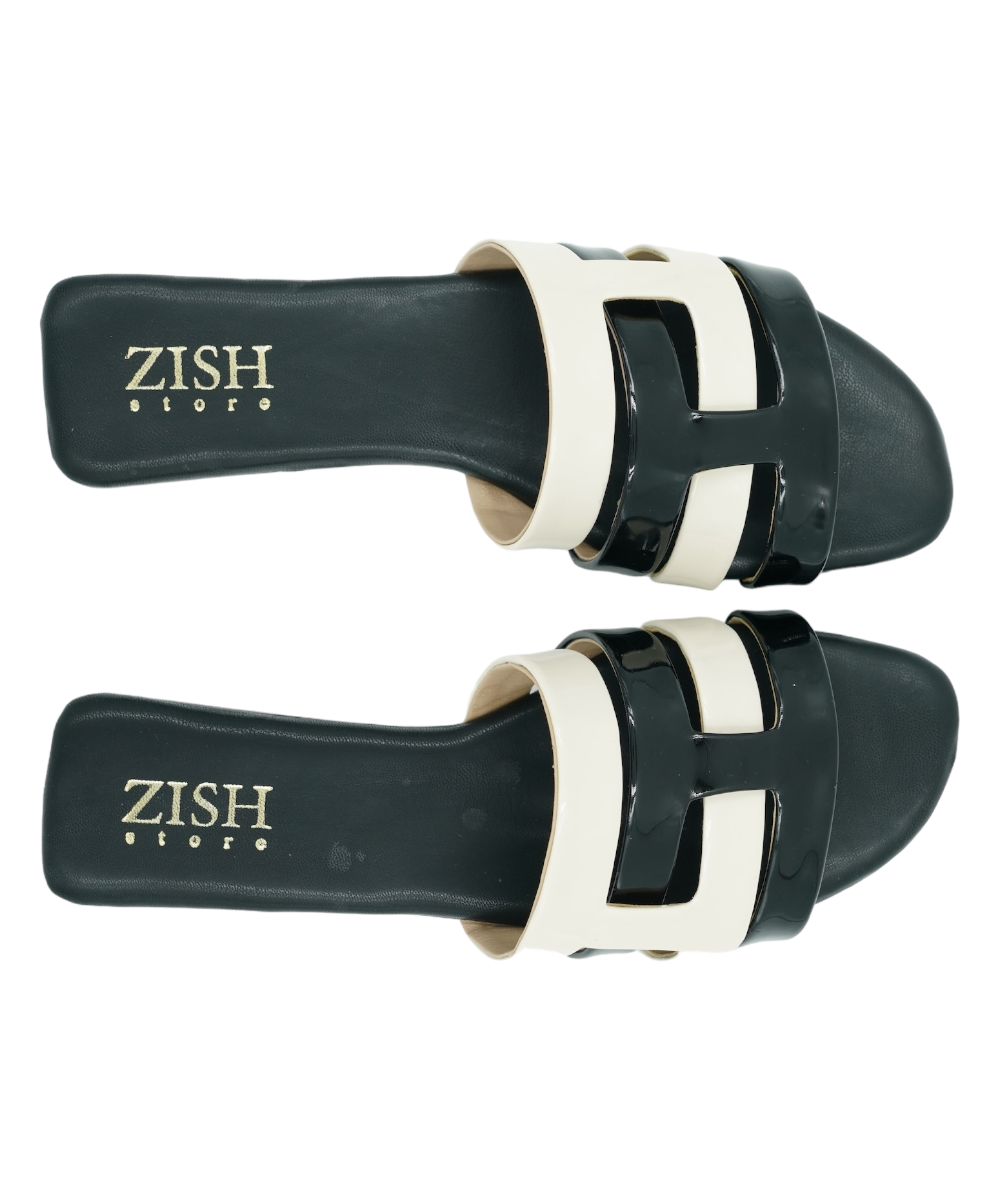 Black Azzura Flats with black and white geometric design and flat open toe sandal style.