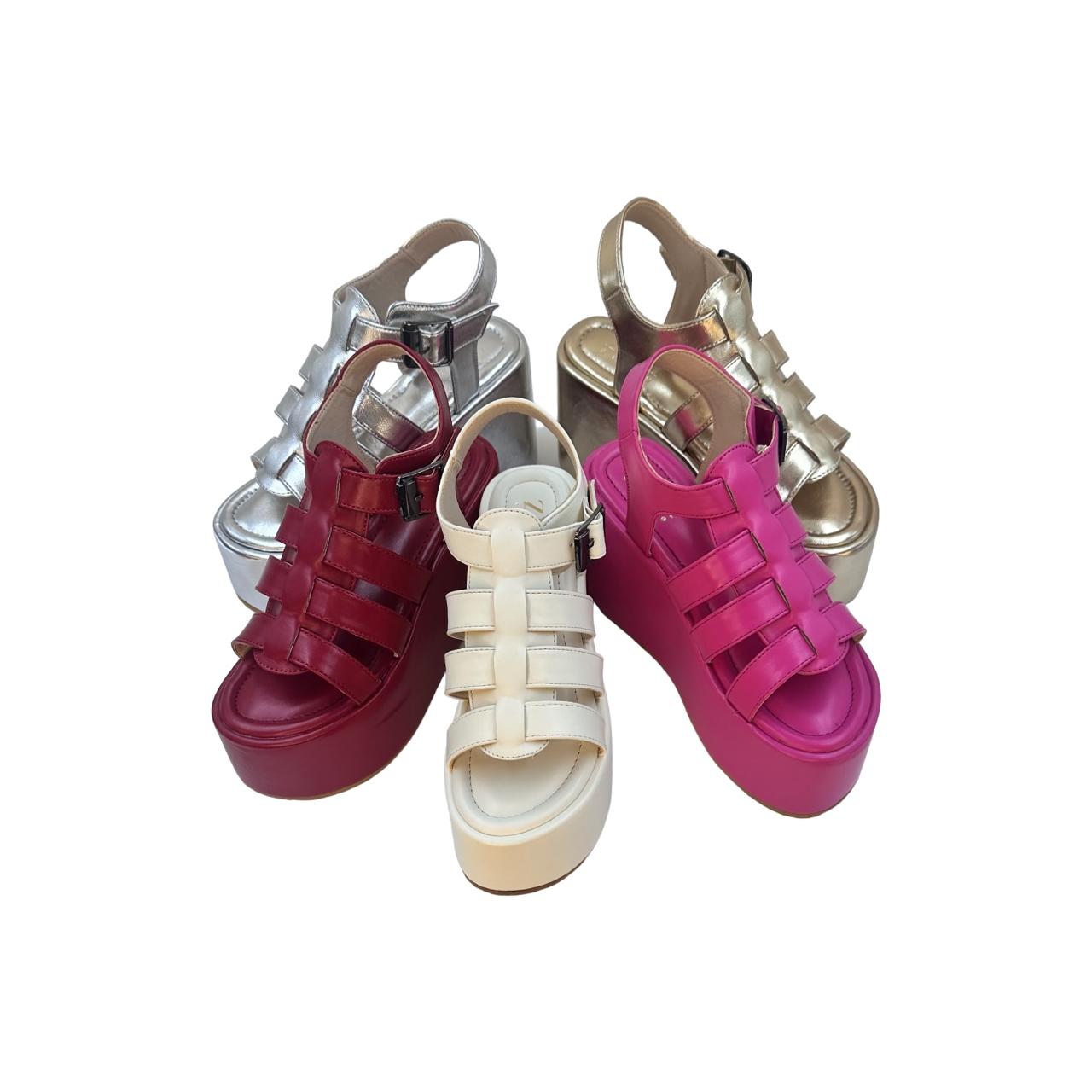 Chunky heel caged platform sandals in gold, silver, red, white, and pink with open toe and vegan leather material.