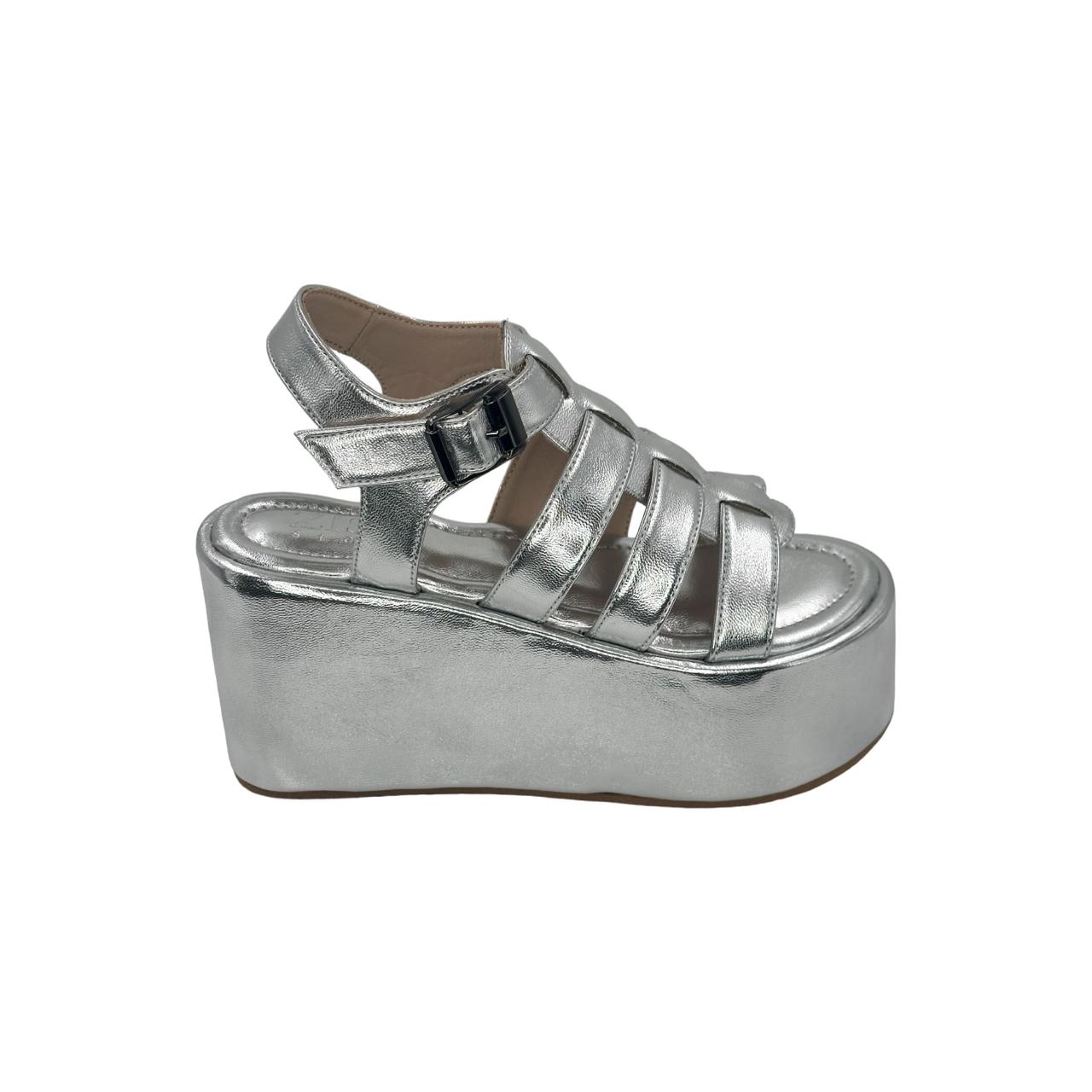 Silver chunky heel caged platform sandals with open toe and ankle buckle closure