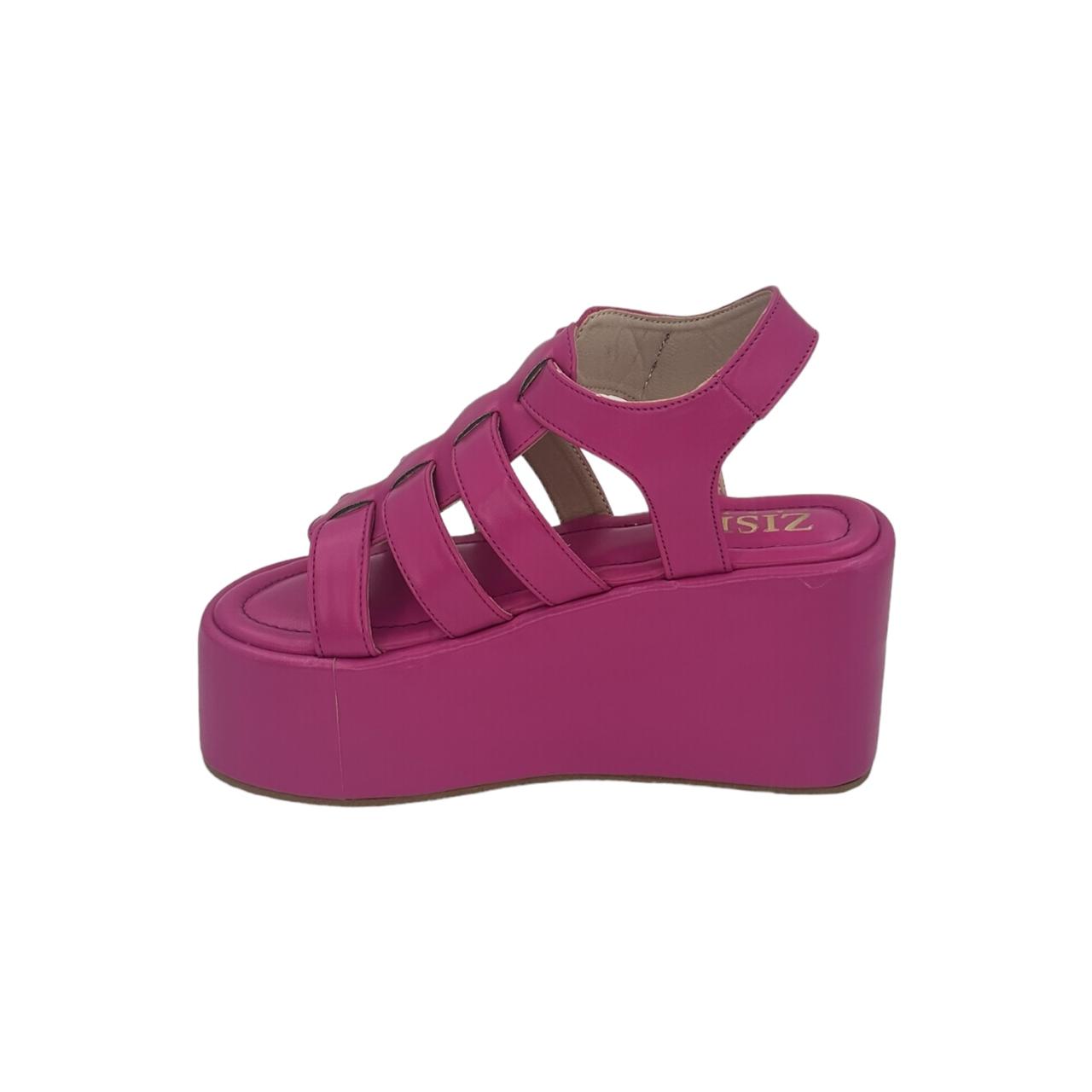 Hot pink chunky heel caged platform sandal with open toe and TPR sole.