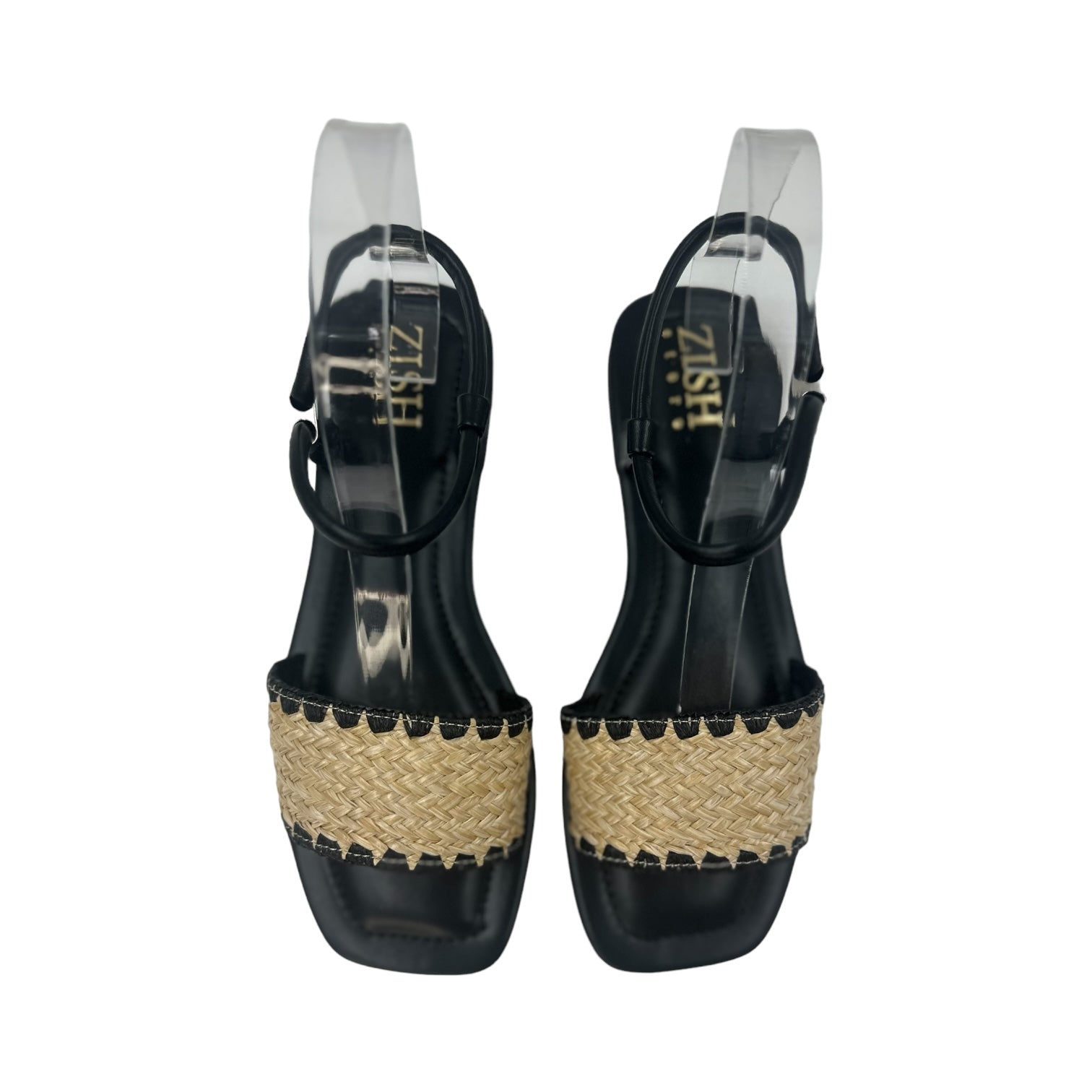 Pair of black flat Ocean Walker sandals with cane upper and open toe design