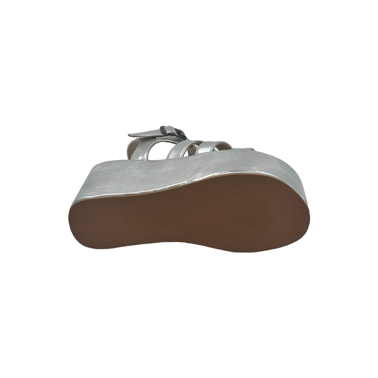 Silver chunky heel caged sandal with platform and TPR sole viewed from bottom isolated on white background