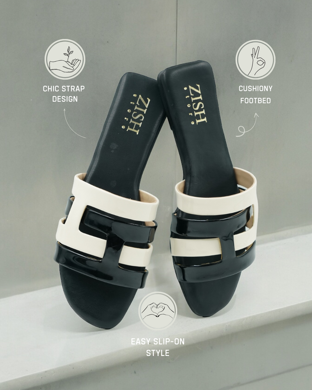 Black Azzura Flats with chic black and white geometric strap design, cushioned footbed, and easy slip-on style