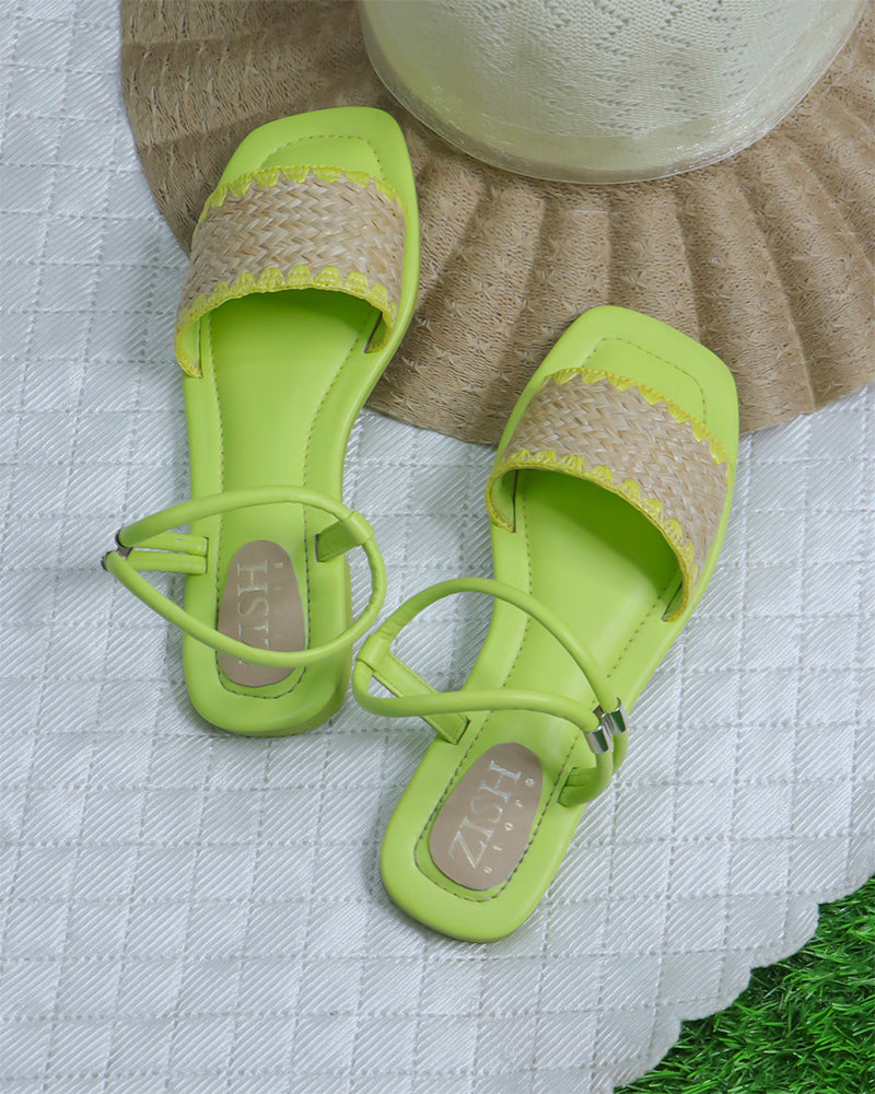 Green Ocean Walker Sandals with cane upper and flat TPR sole on textured surface