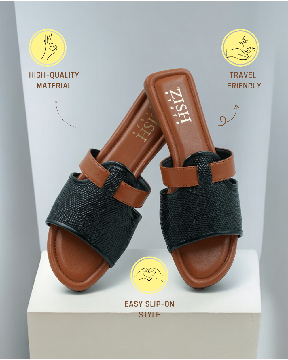 Black Meghan Flats with woven textured black straps and brown cushioned footbed, slip-on style sandals made from high-quality PU vegan leather, travel-friendly and flat heel design.